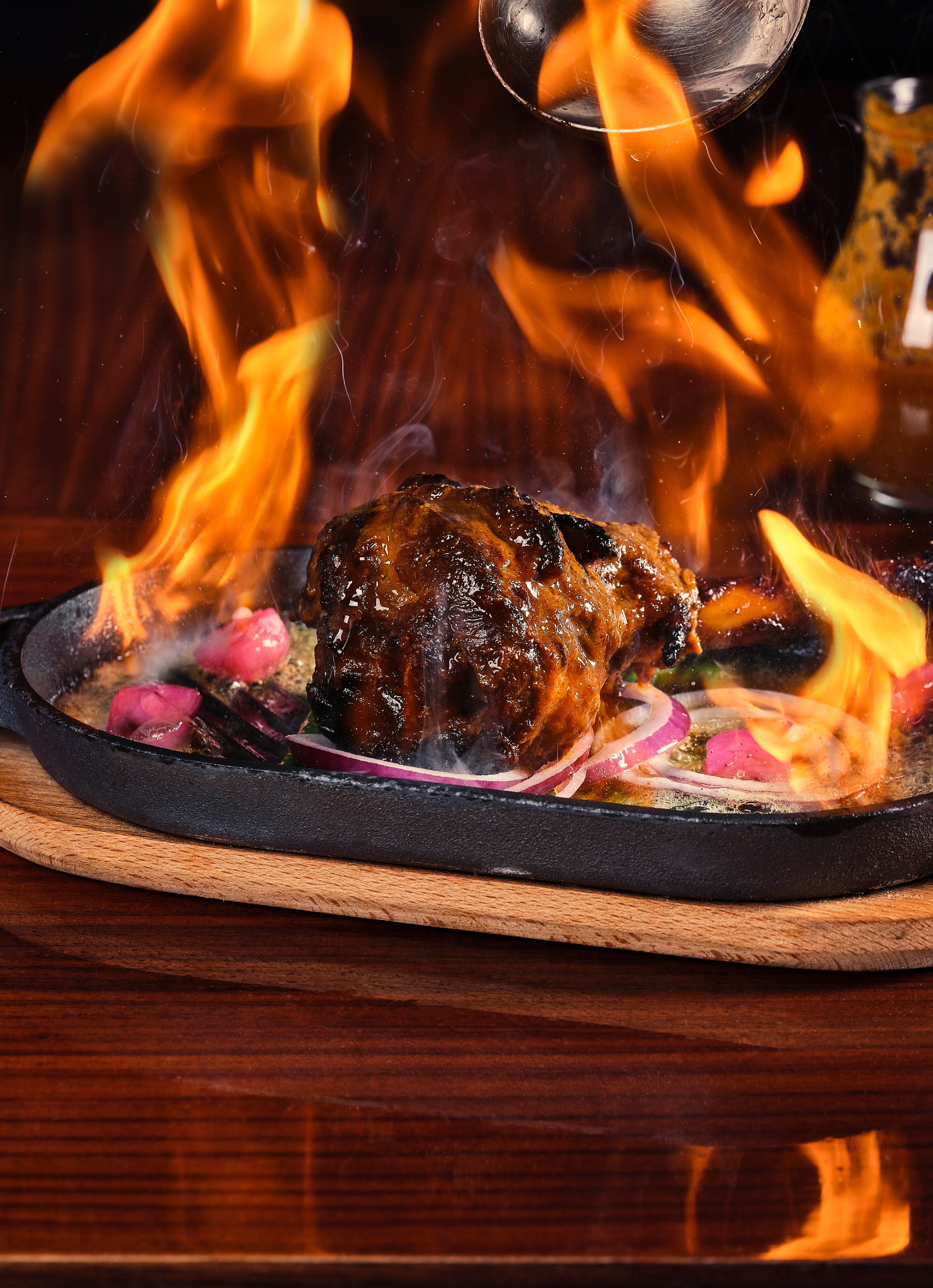 Amaya - Tandoori Spiced Leg of Lamb (Raan) flambéed at the table 